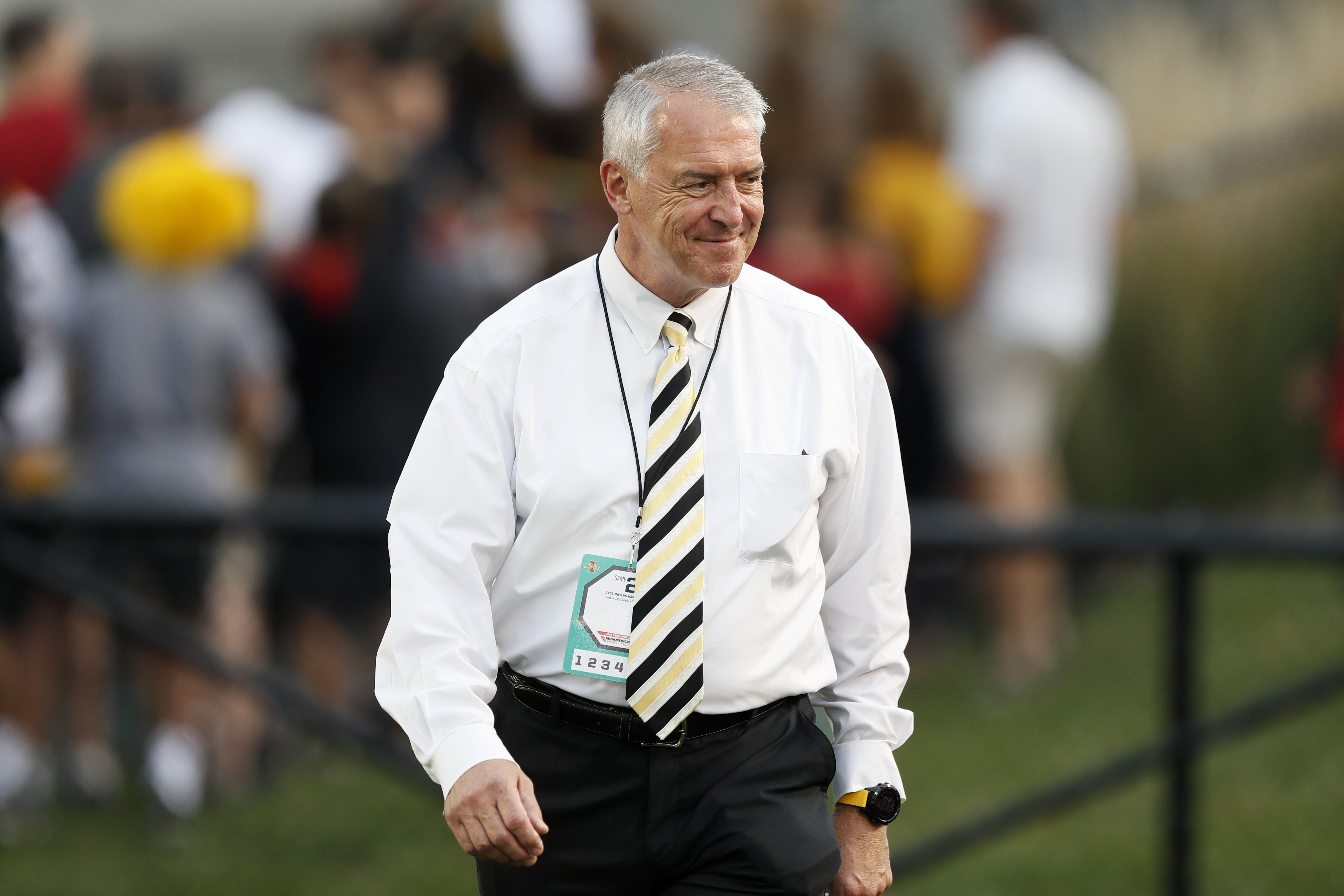 FILE - University of Iowa Athletic Director Gary Barta walks on the field before an NCAA college football game between Iowa State and Iowa on Sept. 14, 2019, in Ames, Iowa. Barta will retire on August 1, 2023, after 17 years at the university, the university announced on Friday, May 26. 