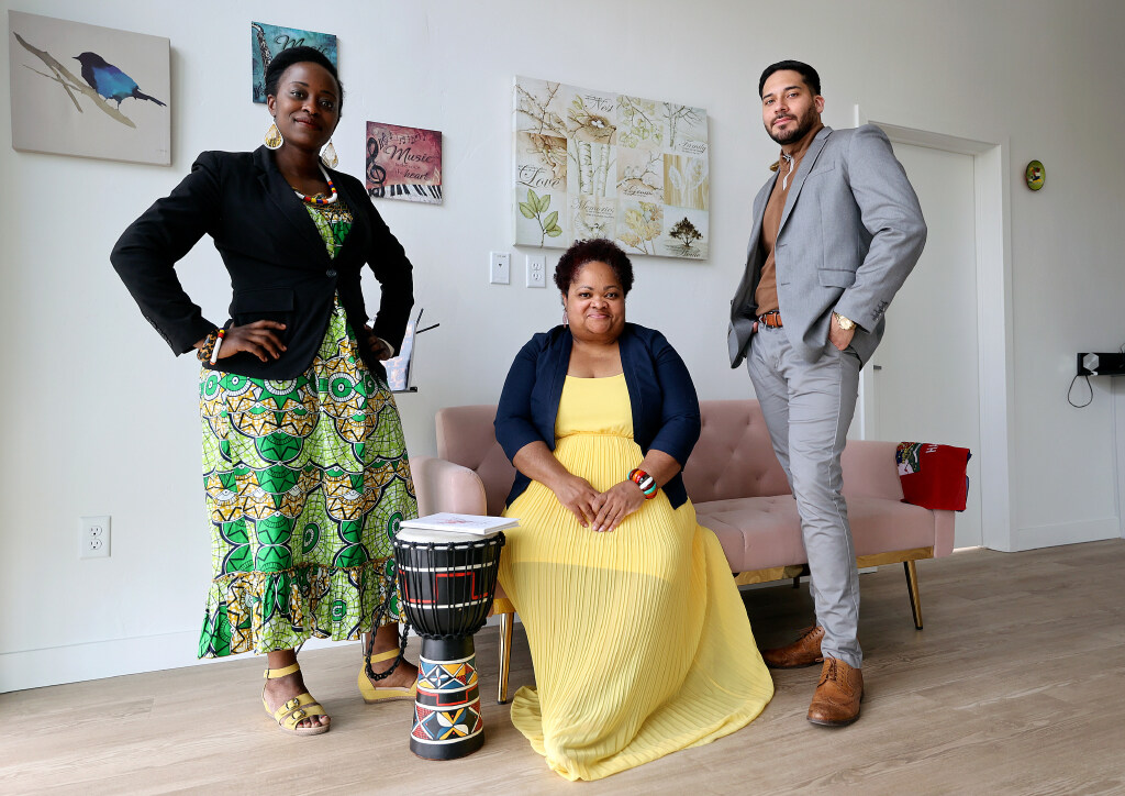 Yvonne Nsabimana, Michaëlle Martial, and Pedro Hueramo Rico pose at Poetry on Main in Salt Lake City on May 10. Poetry on Main hopes to offer spaces for LGBTQ people and artists of color to flourish. 