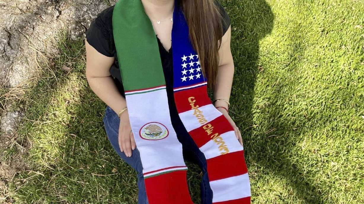 Naomi Peña Villasano poses with a sash of both the Mexican and American flags that her school district barred her from wearing for her high school graduation ceremony.