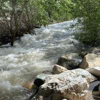 High mountain snow melt fills rivers and creeks as peak runoff nears