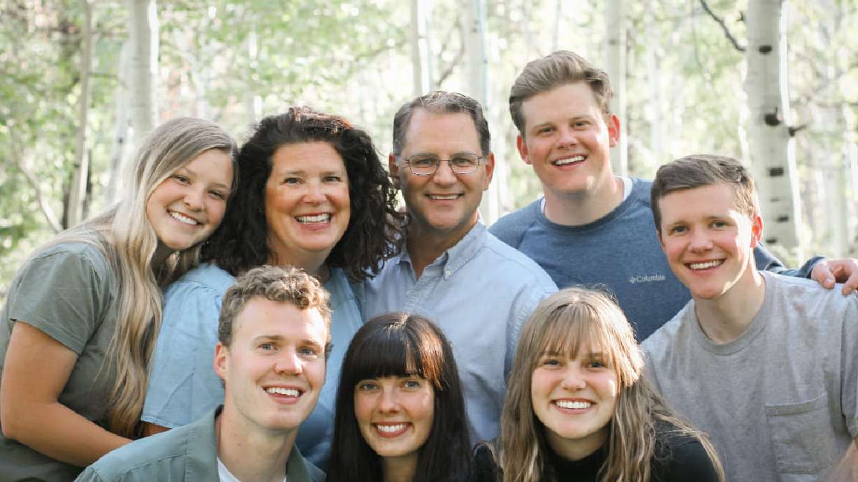 The Cook family, with Ephraim Cook at back right. The family of the Murray man who died in a rock climbing accident Wednesday remember him as adventurous, loving and full of life.