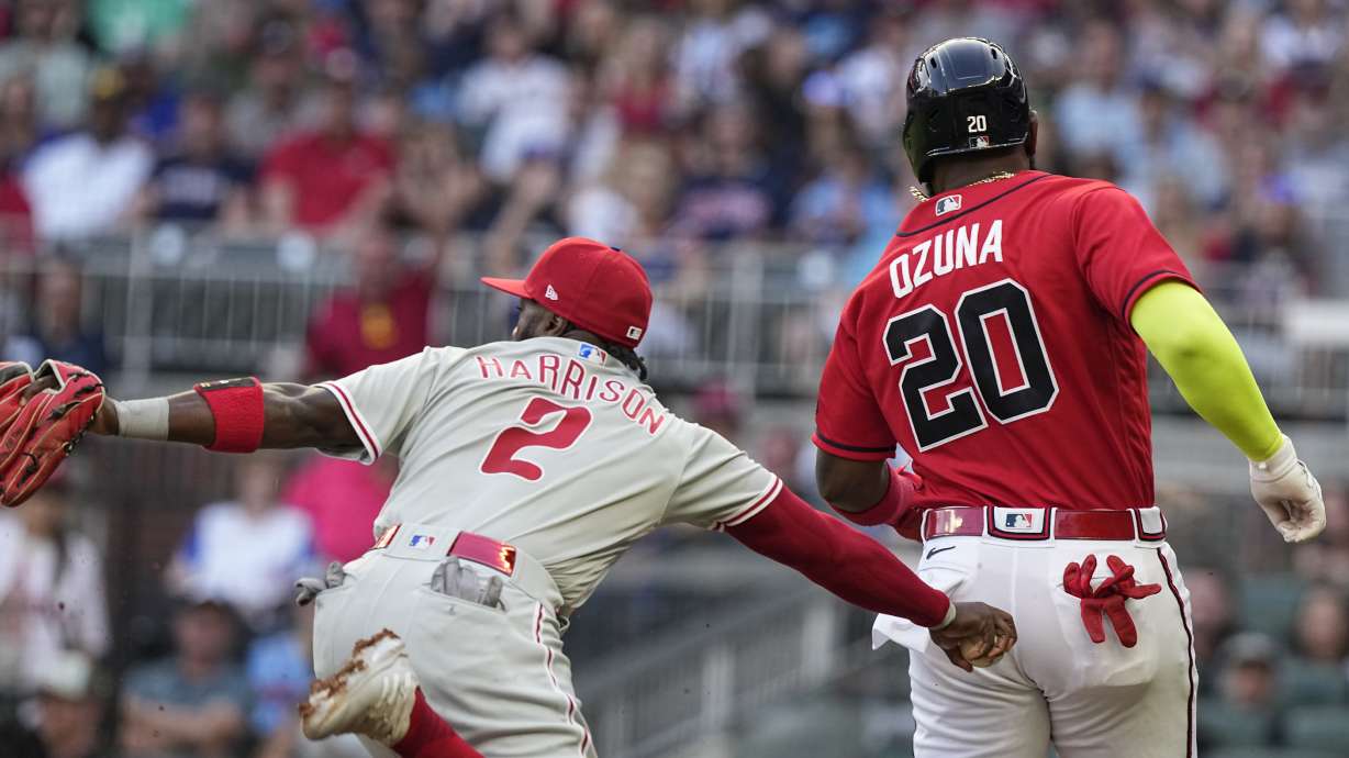 Philadelphia Phillies third baseman Josh Harrison (2) tags out Atlanta Braves' Marcell Ozuna during the second inning of a baseball game Friday, May 26, 2023, in Atlanta.
