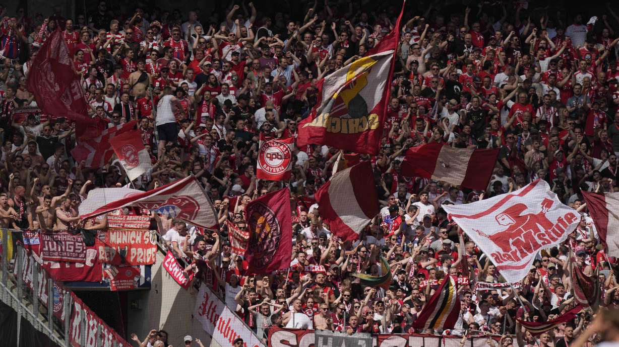 Bayern supporter celebrate during the German Bundesliga soccer match between 1. FC Cologne and FC Bayern Munich in Cologne, Germany, Saturday, May 27, 2023.