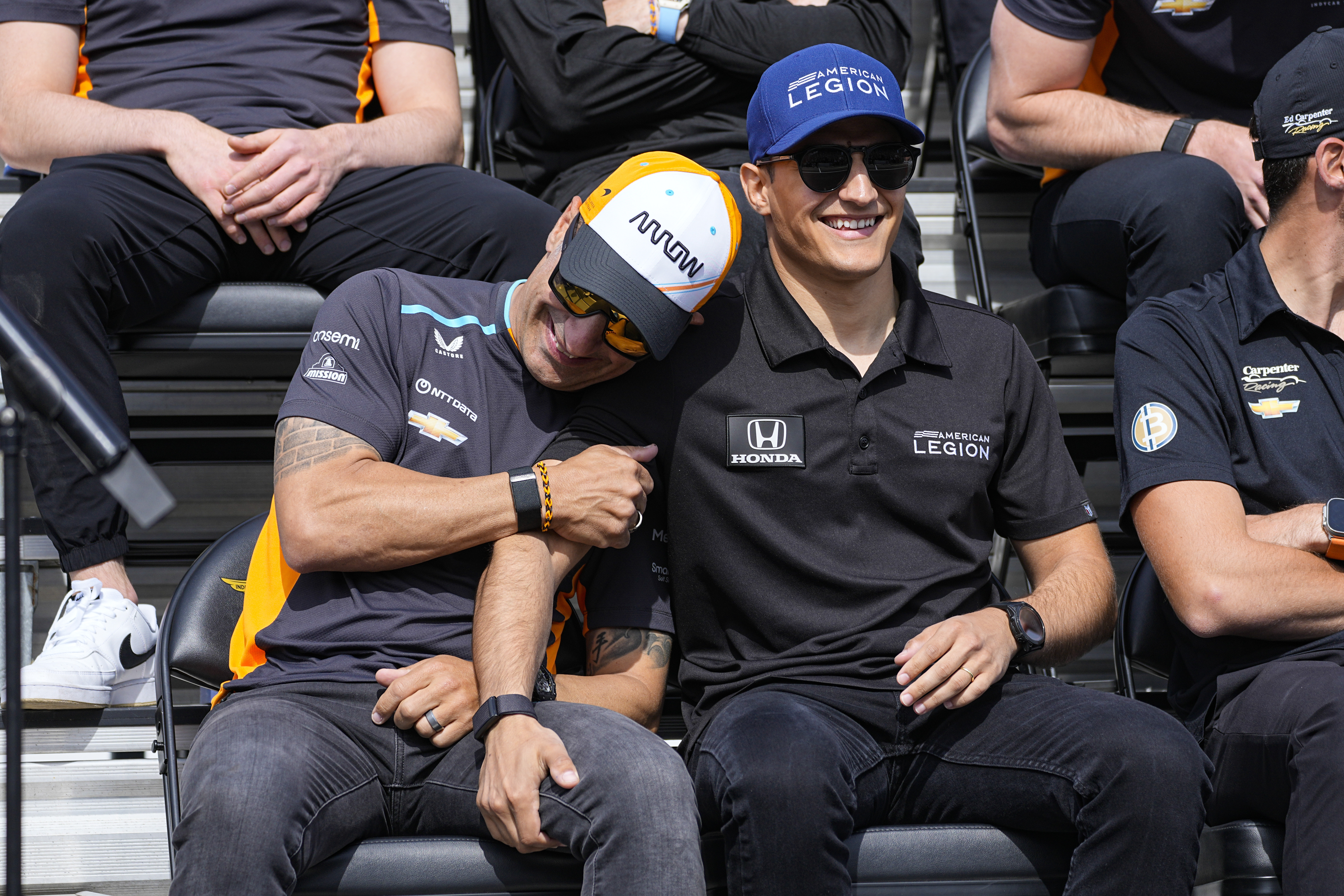Tony Kanaan, of Brazil, left, jokes with Alex Palou, of Spain, during the drivers meeting for the Indianapolis 500 auto race at Indianapolis Motor Speedway in Indianapolis, Saturday, May 27, 2023.