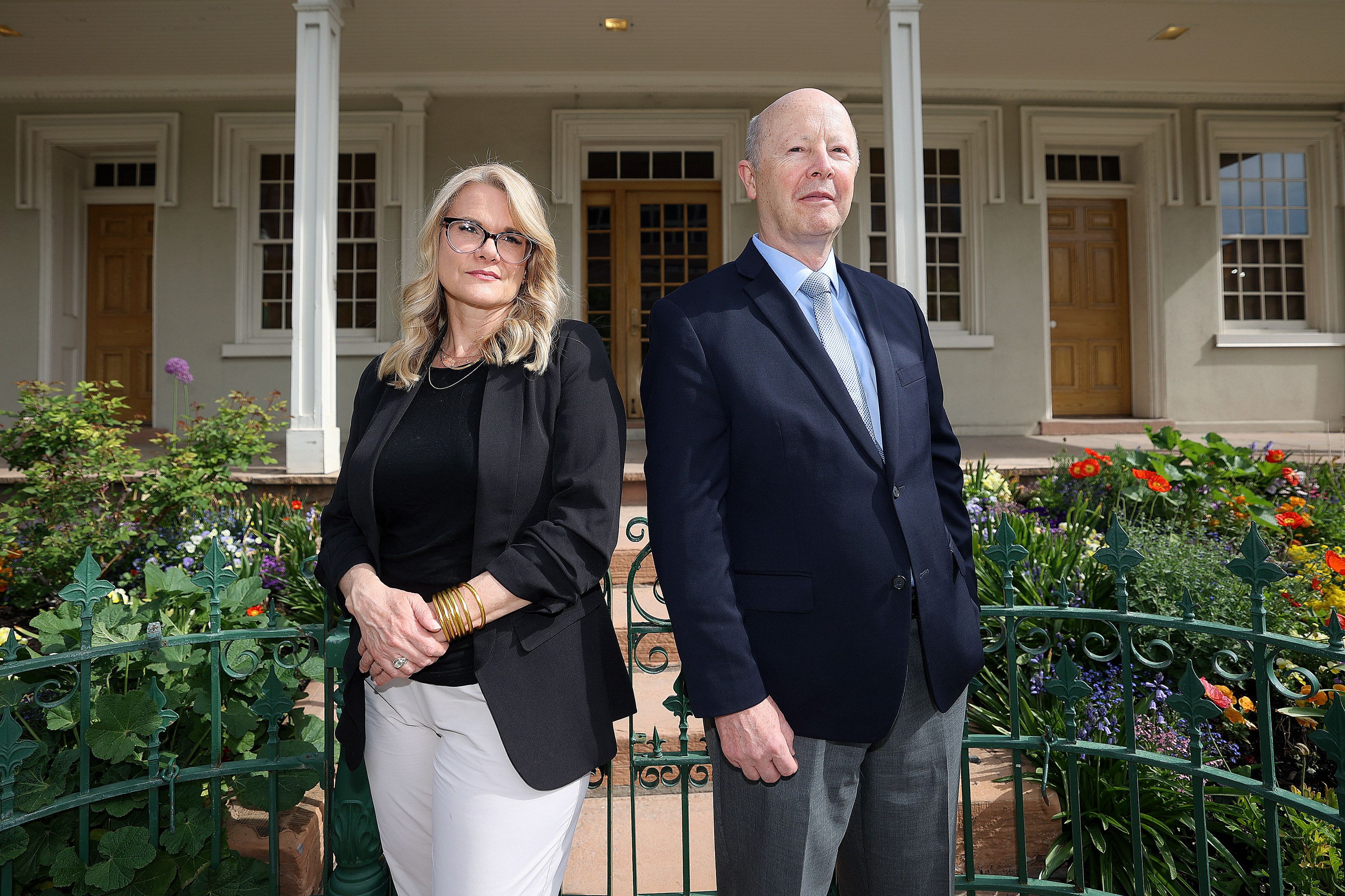 Barbara Jones Brown and Richard Turley, co-authors of “Vengeance is Mine,” pose for a portrait outside of the Beehive House in Salt Lake City on May 12. The opening scene of their book takes place where they are standing, in front of the Beehive House.