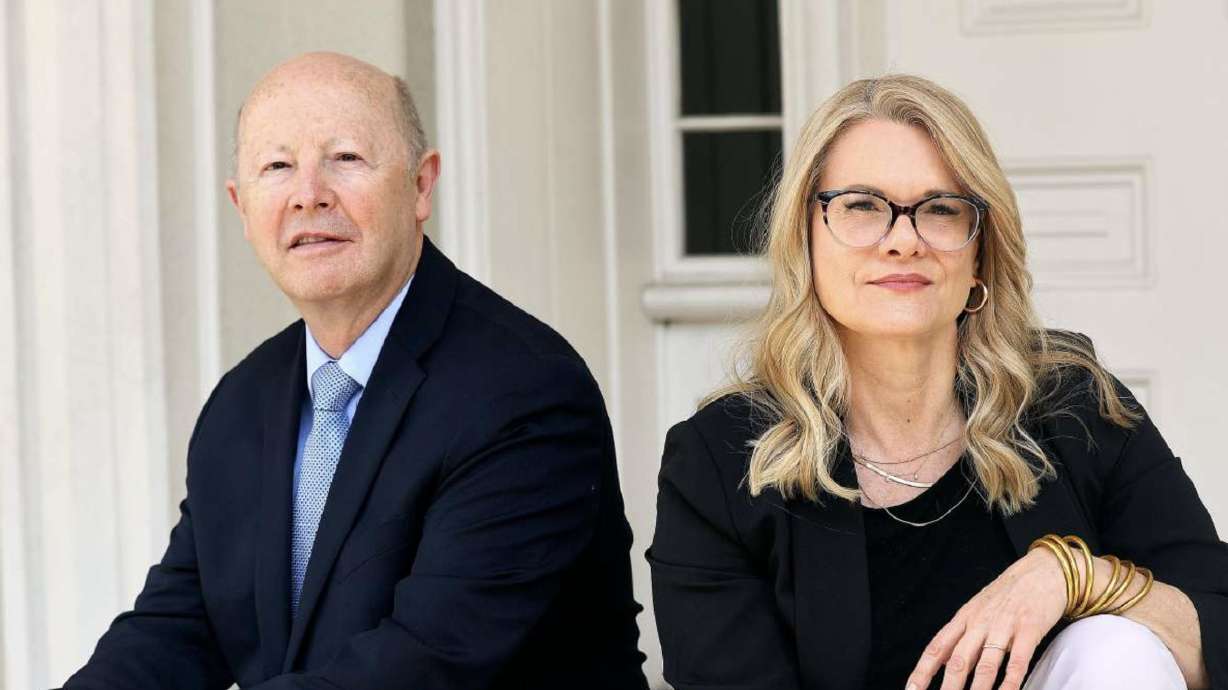 Richard Turley and Barbara Jones Brown, co-authors of “Vengeance is Mine,” pose outside the Beehive House in Salt Lake City on May 12. The opening scene of their book takes place where they are standing, in front of the Beehive House.