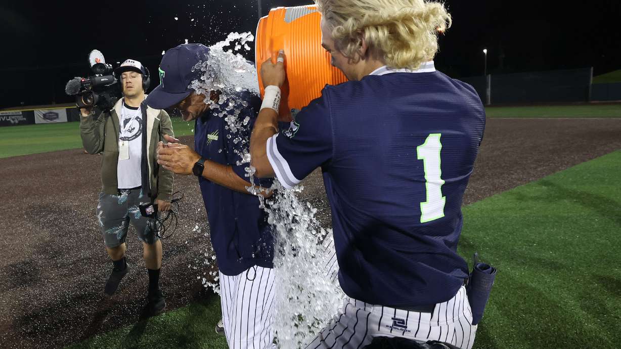 Timpanogos players celebrate their win over Lehi in the 5A state baseball championship in Orem on Saturday, May 27, 2023.