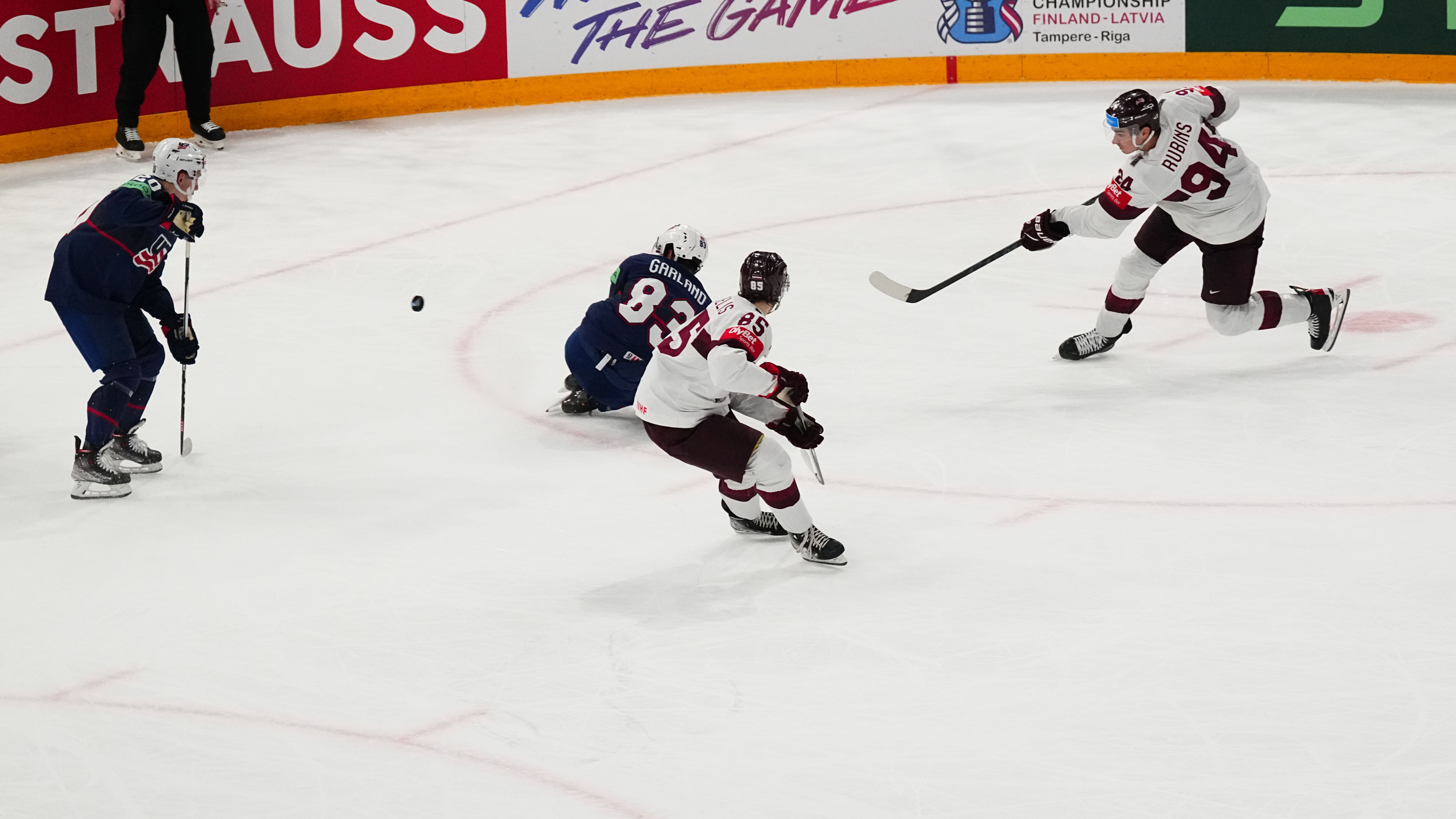 Latvia's Kristians Rubins (94) shoots the game winning shot in overtime of their bronze medal match against the United States at the Ice Hockey World Championship in Tampere, Finland, Sunday, May 28, 2023. Latvia won 4-3.