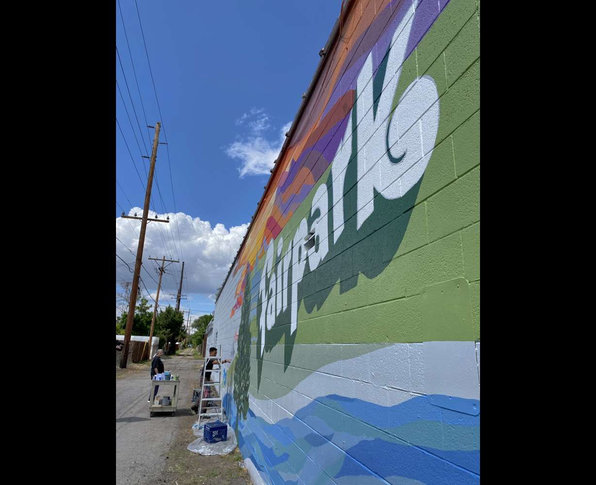 Artists, homeowners and business owners converged on an alleyway in the Fairpark neighborhood on Saturday in hopes a mural would curb graffiti issues while offering hope for the future of the area.