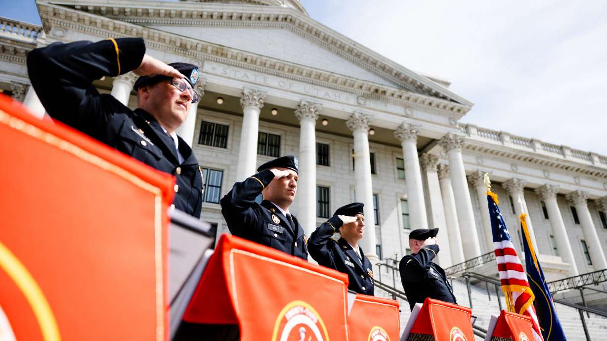Members of the Utah National Guard 23rd Army Band salute during a Memorial Day commemorative event at the Capitol Monday.