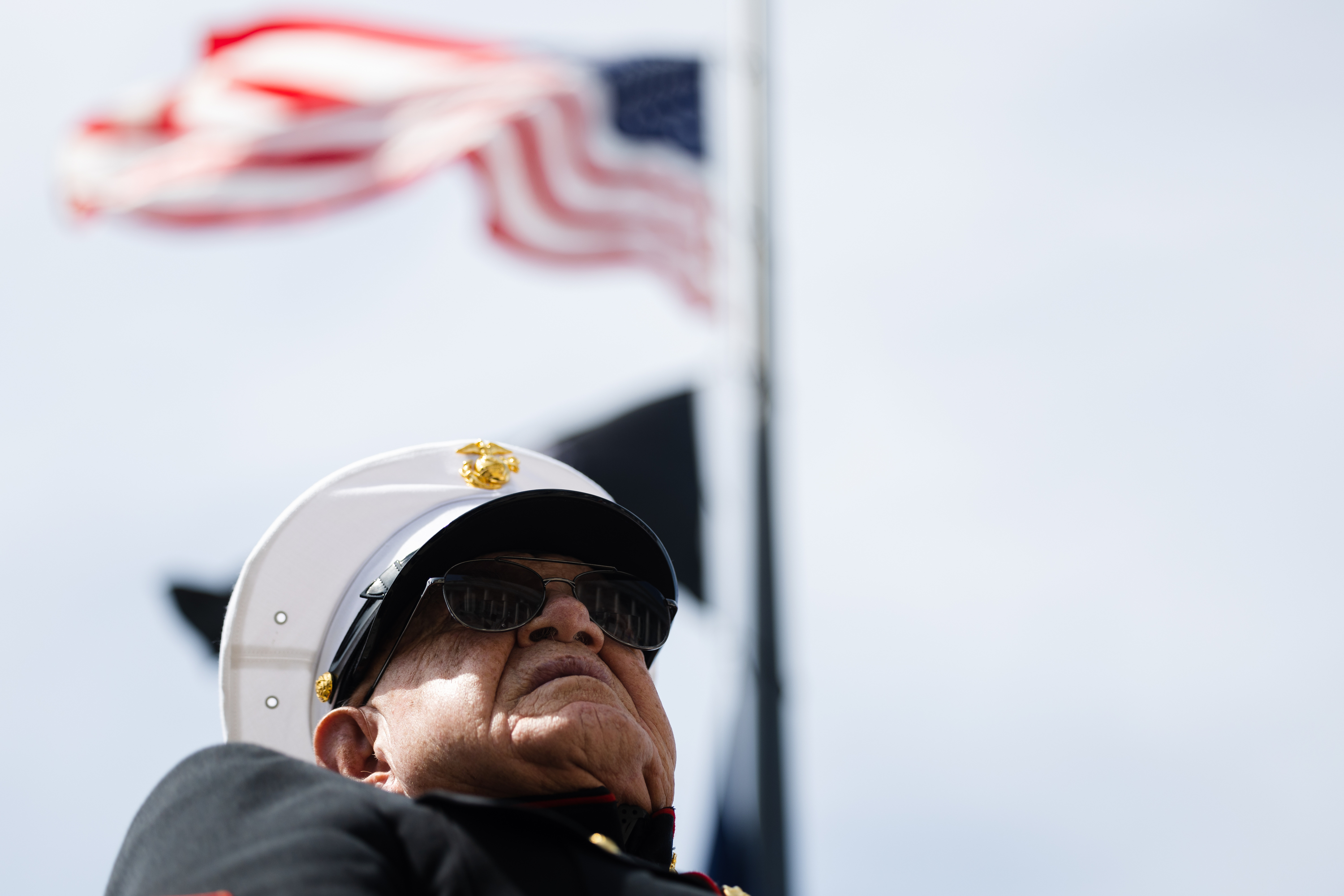 The United States flag is seen above retired United States Marine Corps Sgt. Randy Beal, during a Memorial Day commemorative event at the Capitol in Salt Lake City on Monday.