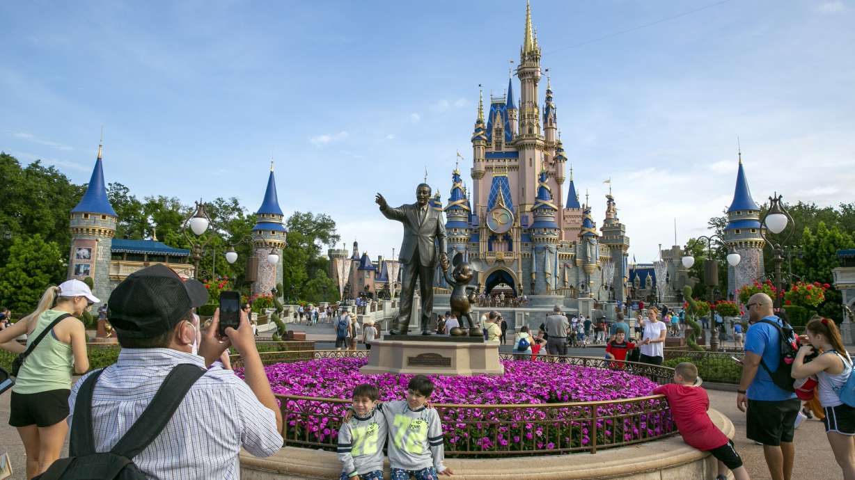 People visit the Magic Kingdom Park at Walt Disney World Resort in Lake Buena Vista, Fla., April 18, 2022. Ongoing strength at its theme parks and an improving streaming business propelled The Walt Disney Co. to higher profits and revenue in its fiscal second quarter in 2023.