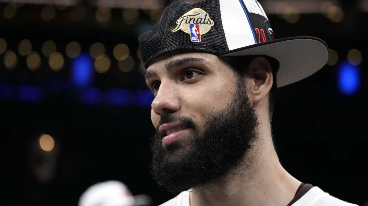 Miami Heat forward Caleb Martin stand on the court after the Heat defeated the Boston Celtics 103-84 in Game 7 of the NBA basketball Eastern Conference finals Monday, May 29, 2023, in Boston.