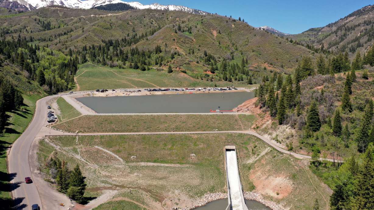 The dam at Tibble Fork Reservoir is pictured in American Fork Canyon on Tuesday. Experts are attempting to answer how extreme weather impacts dams and flood control basins scattered throughout Utah and the rest of the United States.
