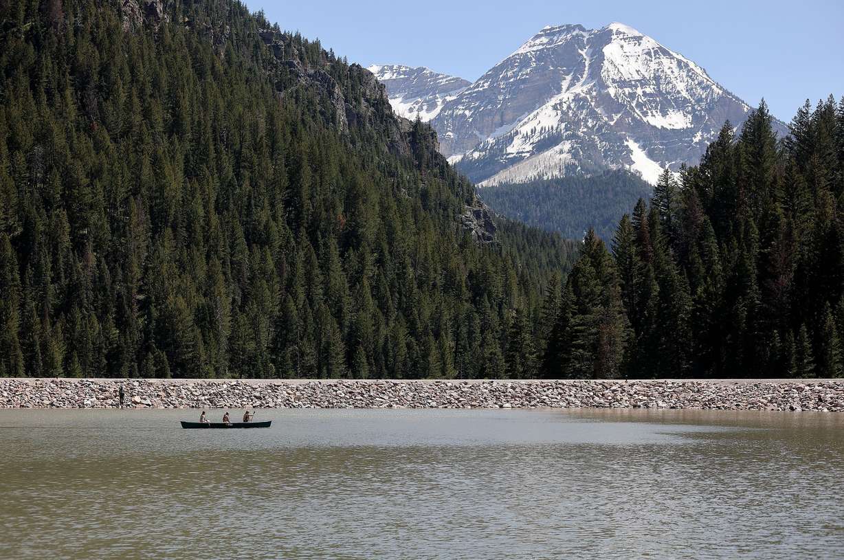 Sydney Veirig, Sage Leatherberry and Scarlett Openshaw canoe in front of the dam on Tibble Fork Reservoir in American Fork Canyon on Tuesday.