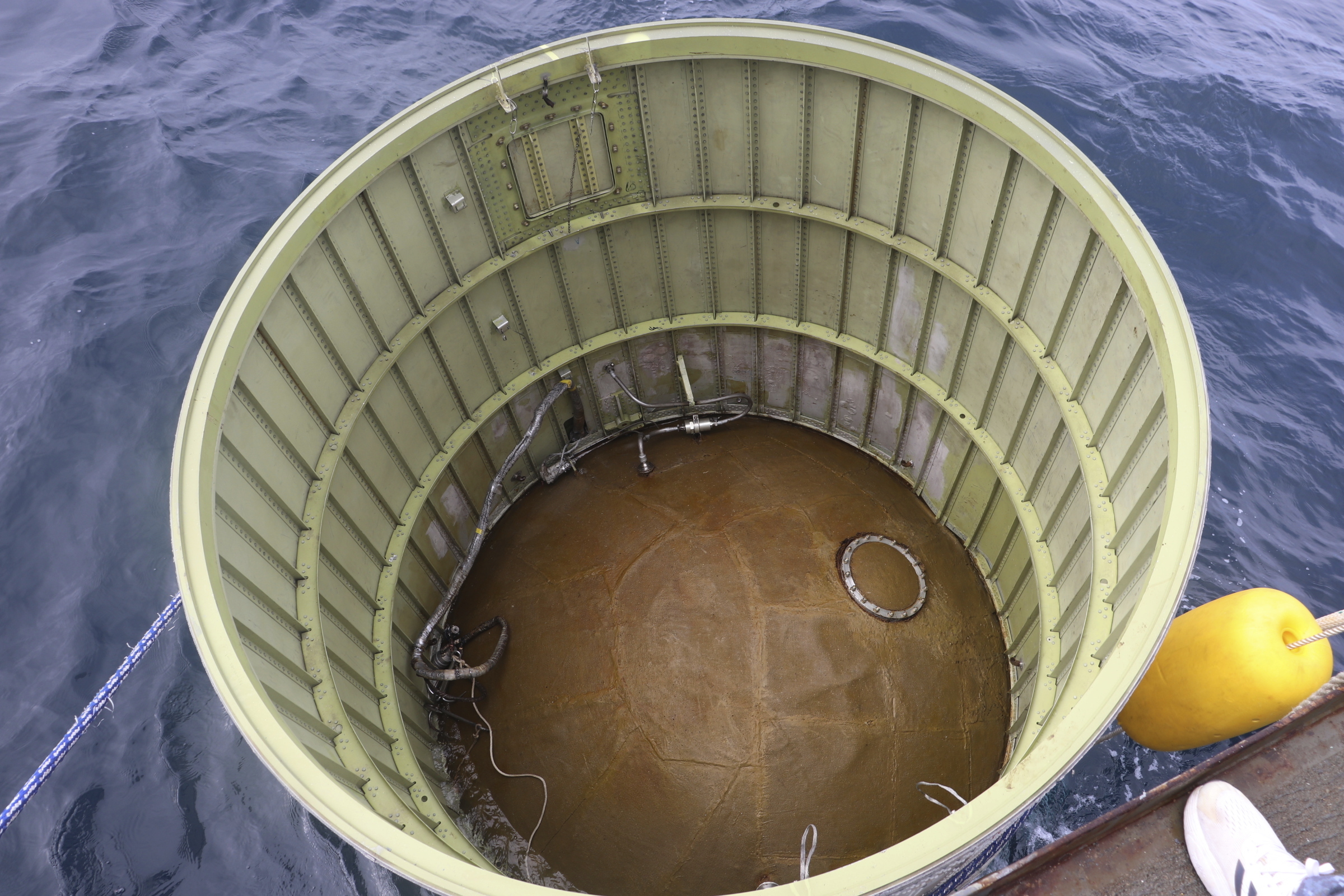 This photo shows an object salvaged by South Korea's military that is presumed to be part of the North Korean space-launch vehicle that crashed into sea following a launch failure in waters off Eocheongdo island, South Korea Wednesday.