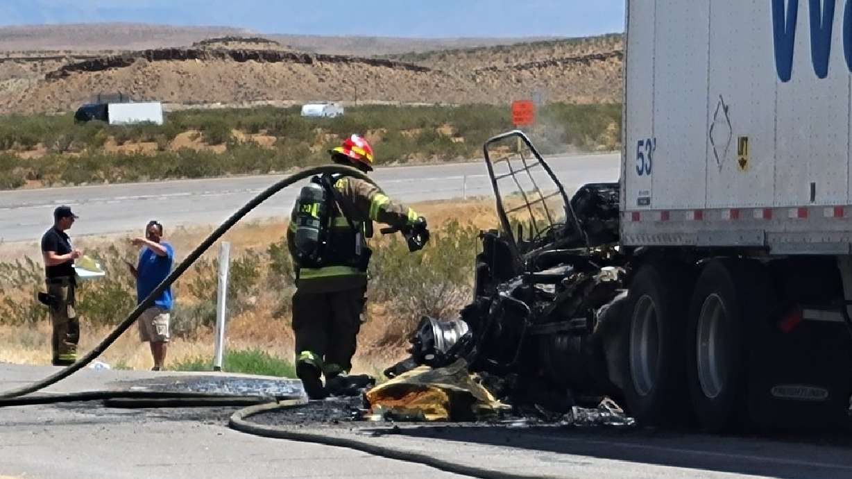 Firefighters battle semitrailer fire on the northbound Interstate 15 on-ramp, Black Rock, Arizona, Wednesday.