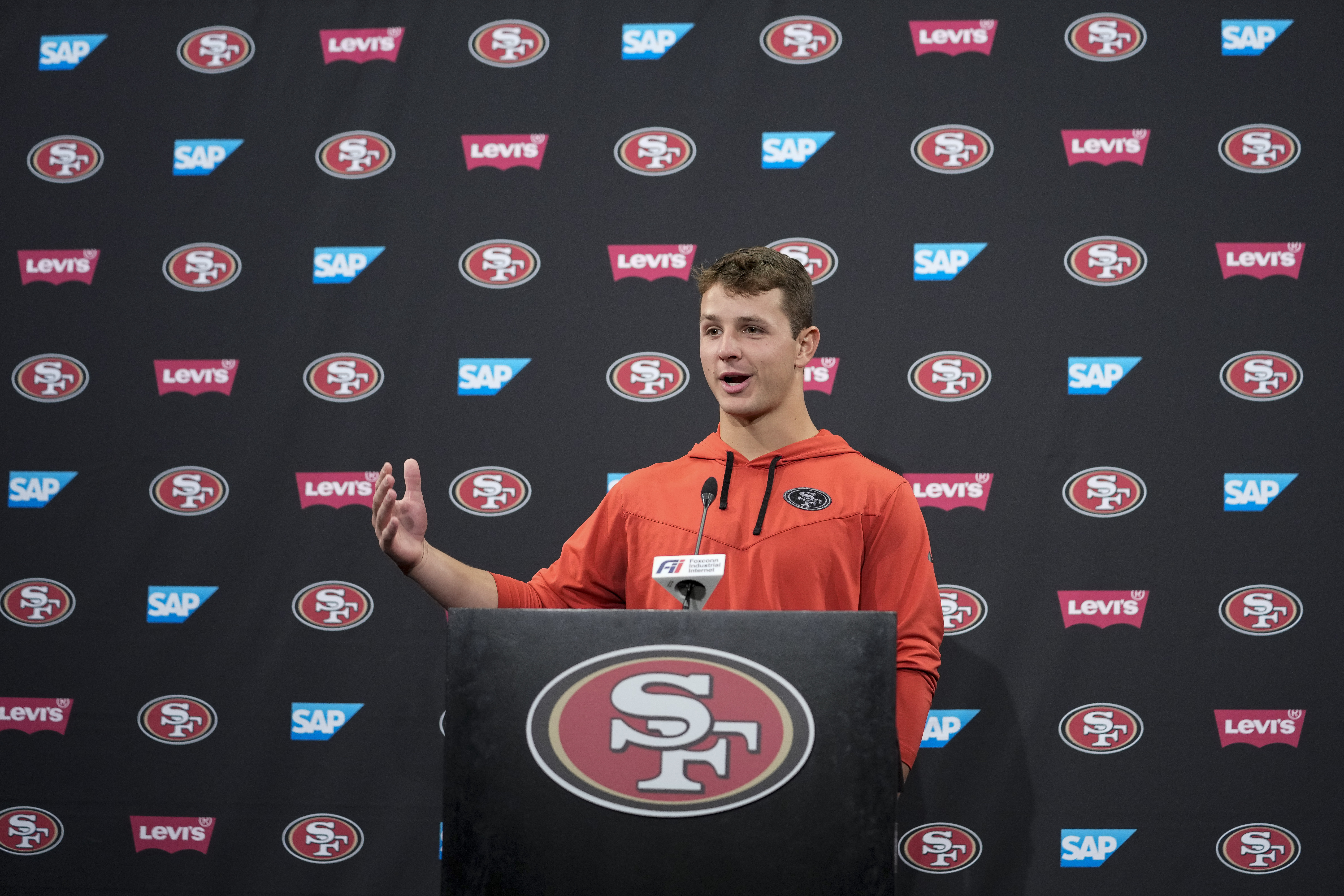 San Francisco 49ers quarterback Brock Purdy speaks to reporters after the NFL football team's practice Tuesday, May 23, 2023, in Santa Clara, Calif.