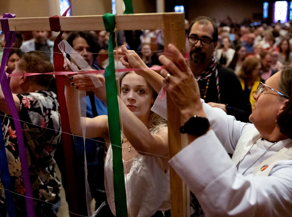 Ribbons are woven into a matrix during the Utah Pride Interfaith Coalition Interfaith Service at the First Baptist Church in Salt Lake City on Wednesday.