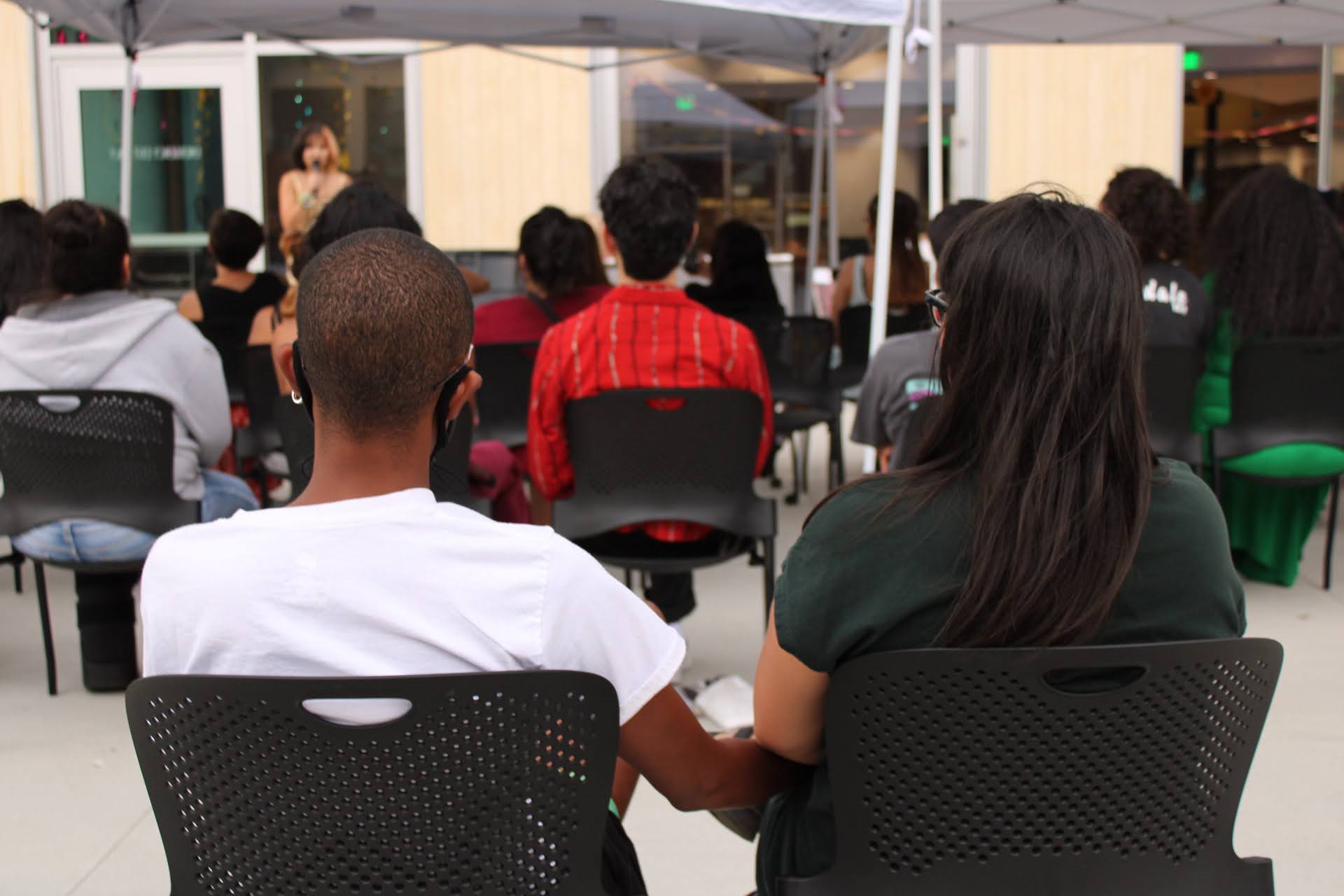 Attendees participate in Burning Sissy Valley's pride event for queer individuals of color at the Kearns Library in 2021.