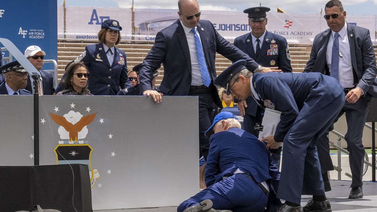 President Joe Biden falls on stage during the 2023 United States Air Force Academy Graduation Ceremony at Falcon Stadium, Thursday in Colorado Springs, Colo.