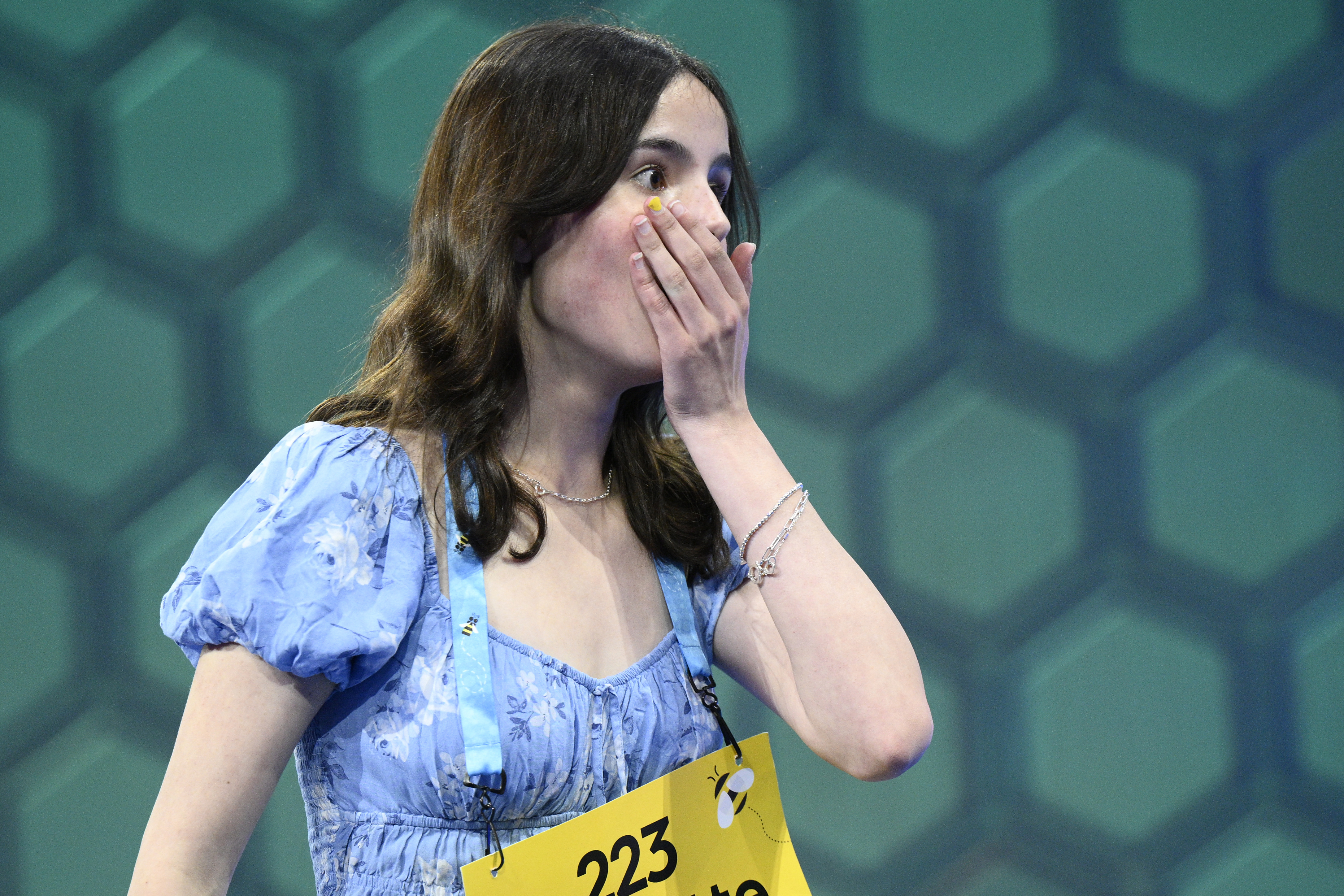 Charlotte Walsh, 14, from Arlington, Va., reacts during the Scripps National Spelling Bee, Wednesday in Oxon Hill, Md.