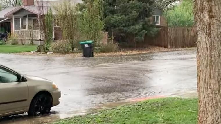 A trash can takes a ride on the waves of the latest storm in Centennial, Colorado, in this May 18 video posted to YouTube.