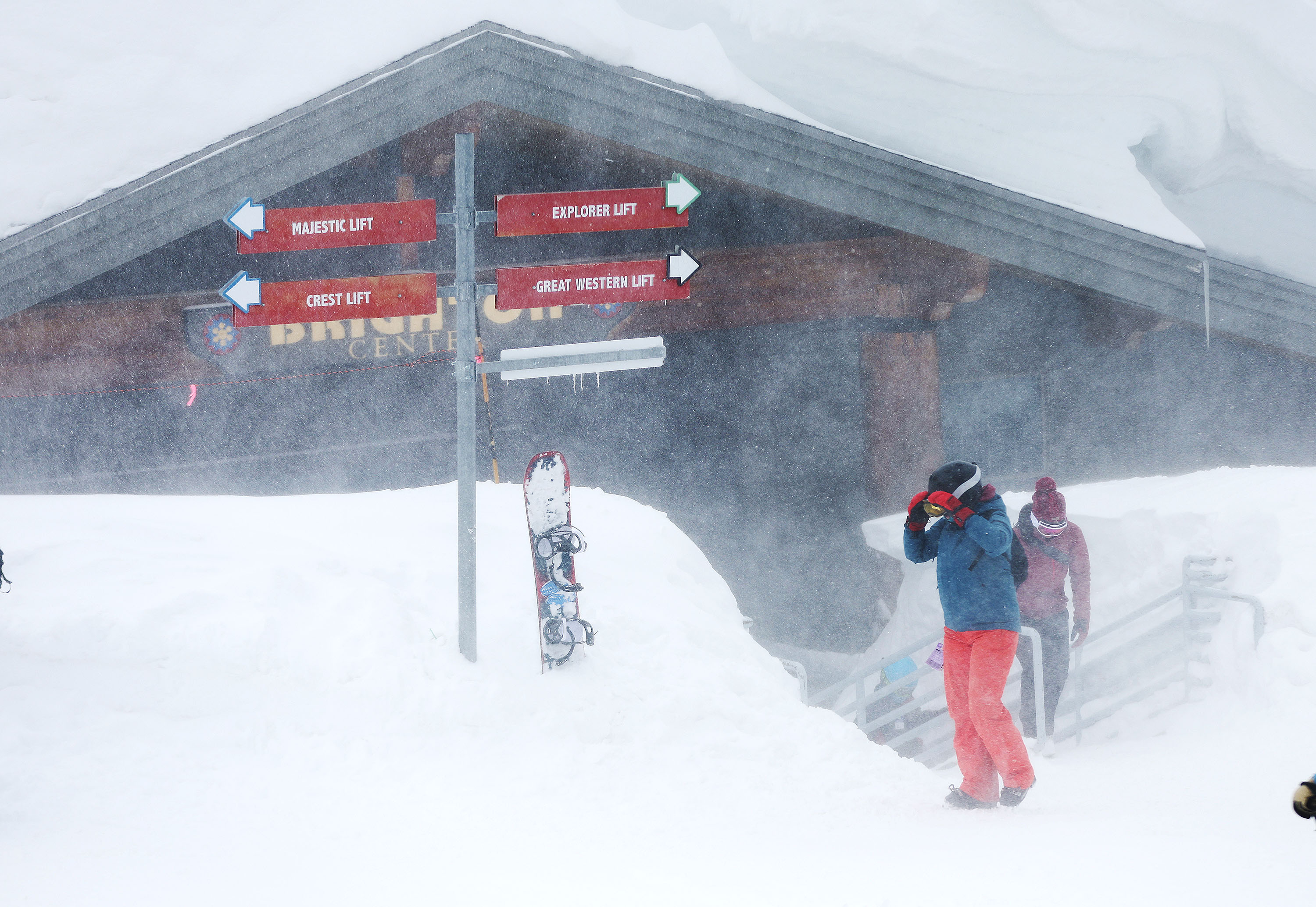 Skiers walk out of the Brighton Center at Brighton Ski Resort in Big Cottonwood Canyon on, April 4. The 2022-2023 ski and snowboard season resulted in a record estimate of 7.1 million visits, Ski Utah officials said Thursday.