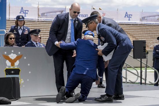 President Joe Biden falls on stage during the 2023 United States Air Force Academy Graduation Ceremony at Falcon Stadium, Thursday at the United States Air Force Academy in Colorado Springs, Colo.