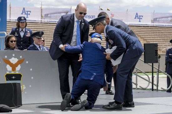 President Joe Biden falls on stage during the 2023 United States Air Force Academy Graduation Ceremony at Falcon Stadium, Thursday at the United States Air Force Academy in Colorado Springs, Colo.