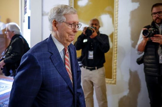 U.S. Senate Minority Leader Mitch McConnell, R-Ky., walks to the Senate floor as lawmakers wrangle over the upcoming vote on debt ceiling legislation to avoid a historic default at the U.S. Capitol in Washington, Thursday.