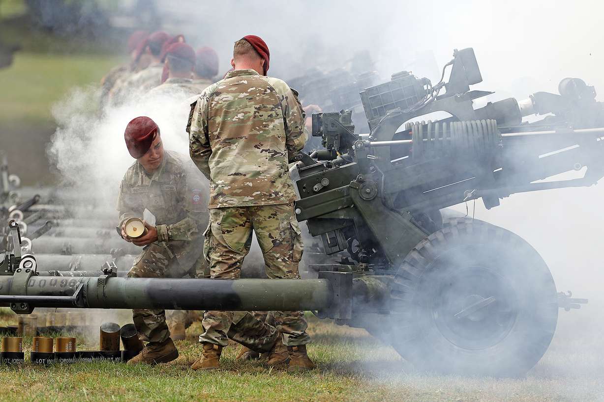 Crews fire their guns during a 15-gun salute as a part of the ceremony to rename Fort Bragg, Friday in Fort Liberty, N.C. The U.S. Army changed Fort Bragg to Fort Liberty as part of a broader initiative to remove Confederate names from bases.