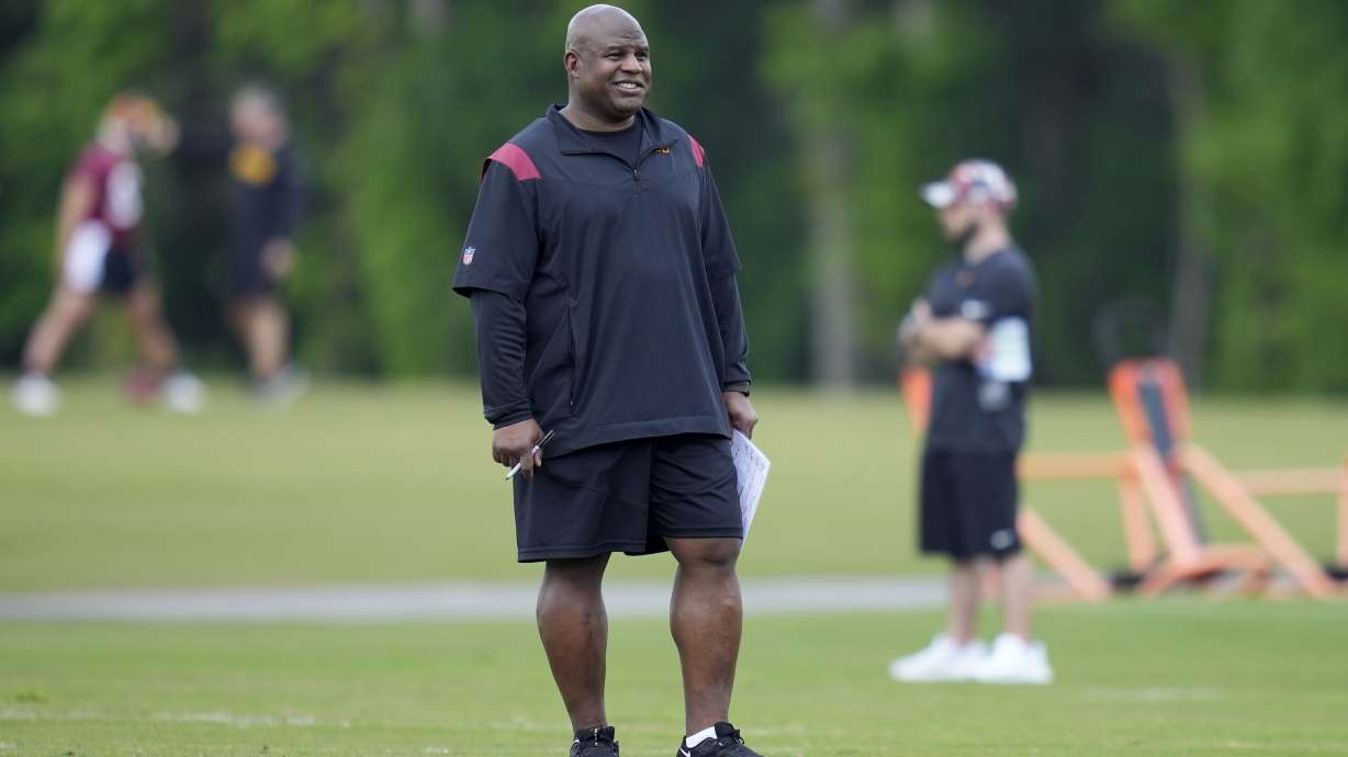 Washington Commanders assistant head coach/offensive coordinator Eric Bieniemy watches the NFL football team's rookie minicamp, Friday, May 12, 2023, in Ashburn, Va.