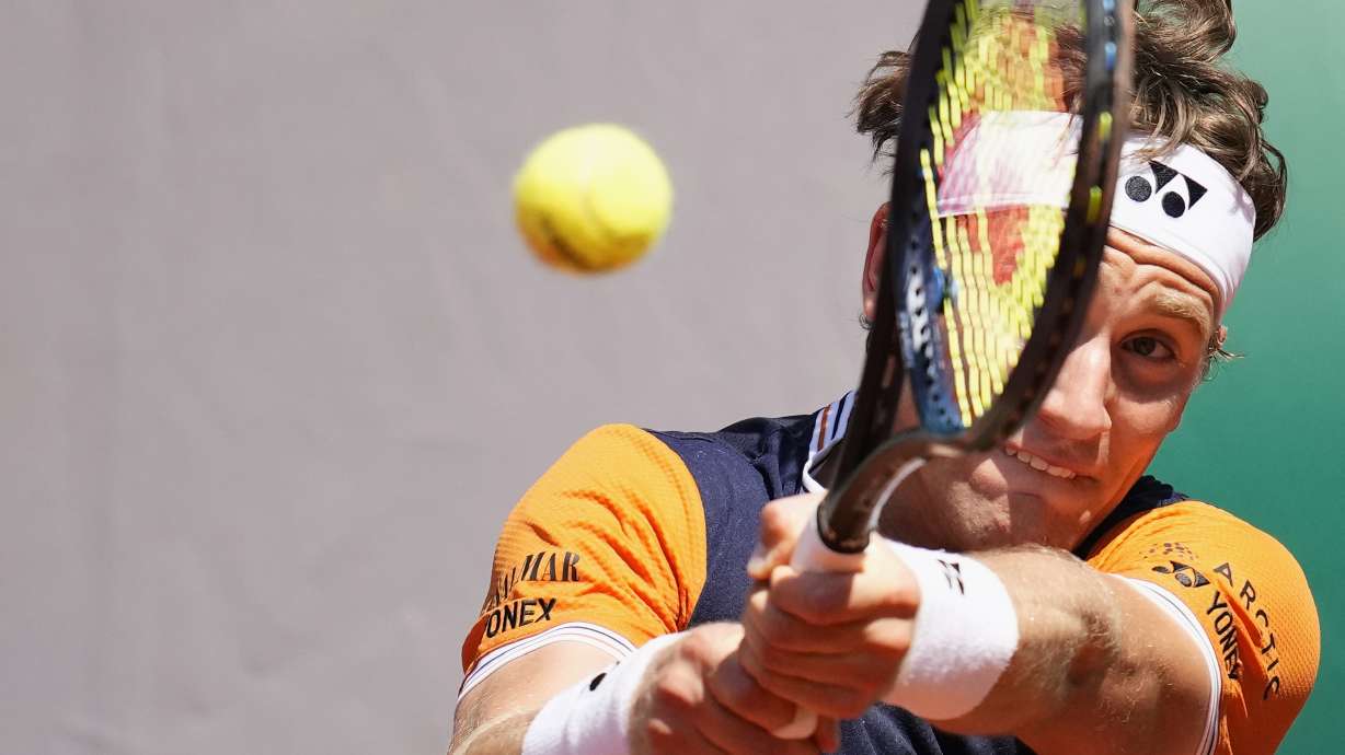 Norway's Casper Ruud plays a shot against China's Zhang Zhizhen during their third round match of the French Open tennis tournament at the Roland Garros stadium in Paris, Saturday, June 3, 2023.