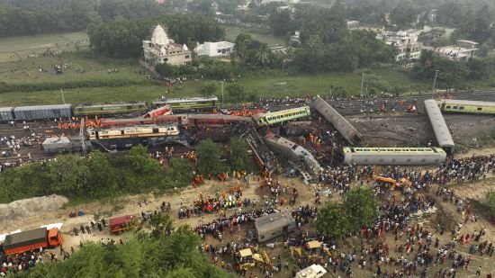 A drone shot of rescuers work at the site of passenger trains accident, in Balasore district, in the eastern Indian state of Orissa, Saturday, June 3, 2023. Rescuers are wading through piles of debris and wreckage to pull out bodies and free people after two passenger trains derailed in India, killing more than 280 people. Hundreds of others were trapped inside more than a dozen mangled rail cars, in one of the country's deadliest train crashes in decades.