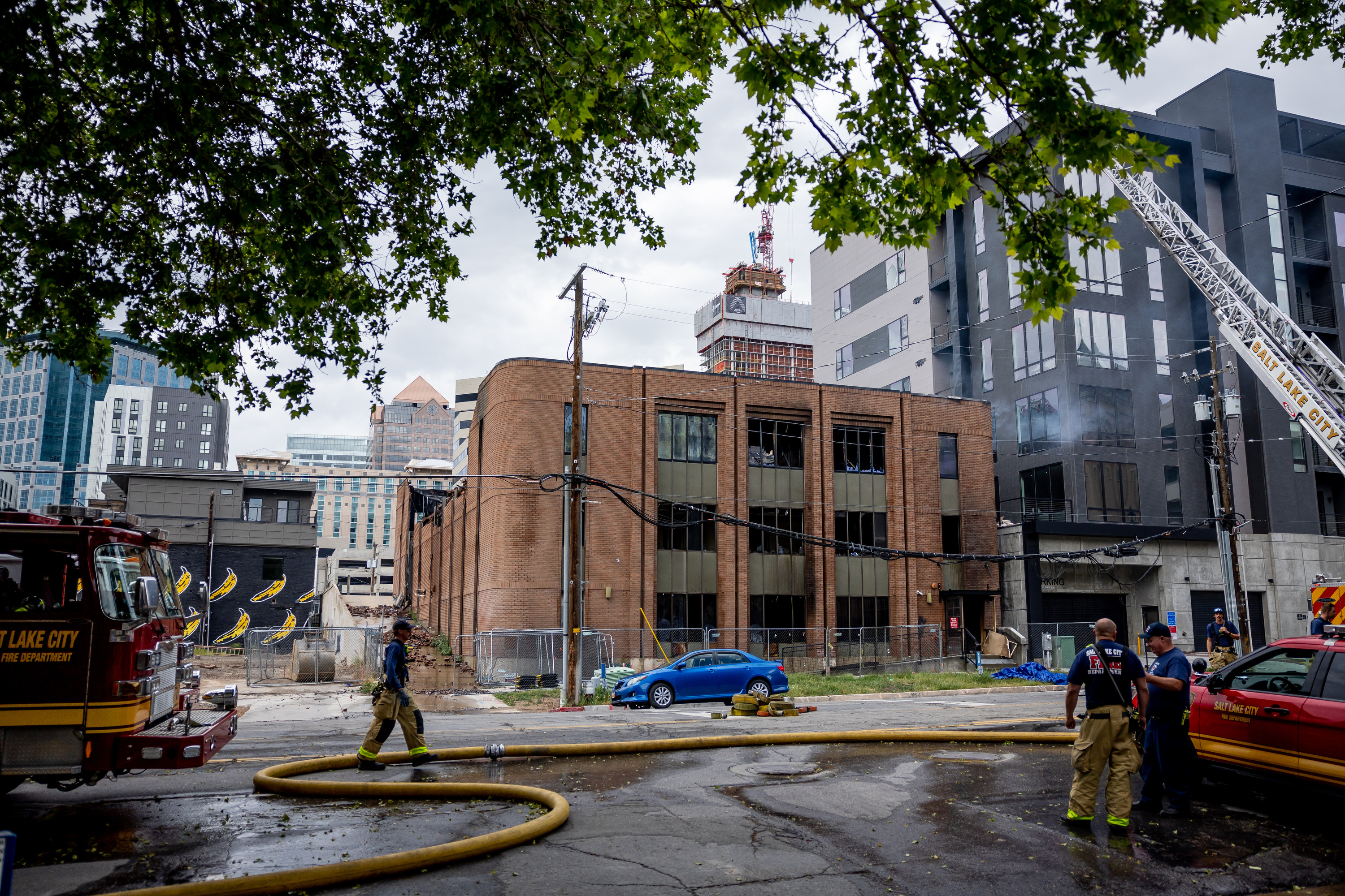 The still-smoldering remains of a vacant building at 220 S. 200 E. in Salt Lake City that caught fire late Friday night are pictured in the afternoon on Saturday.