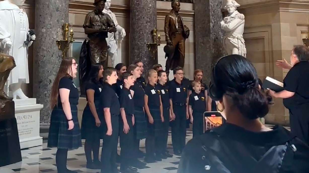 The Rushingbrook Children’s Choir sings the “Star-Spangled Banner” in the U.S. Capitol’s Statuary Hall on Friday in Washington. Capitol Police say the show was stopped because there was a miscommunication.