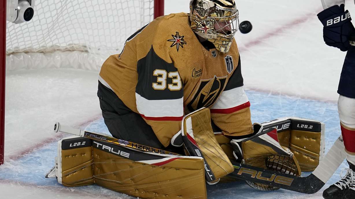 Vegas Golden Knights goaltender Adin Hill (33) stops a shot on goal against the Florida Panthers during the first period of Game 1 of the NHL hockey Stanley Cup Finals, Saturday, June 3, 2023, in Las Vegas.