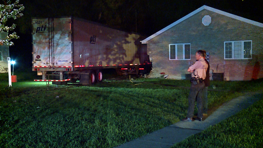 The Maxfield family had to sort through their belongings after a semitruck and trailer smashed through their Bear Lake property.