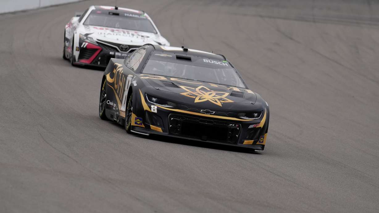Kyle Busch, front, drives followed by Denny Hamlin (11) during a NASCAR Cup Series auto race at World Wide Technology Raceway, Sunday, June 4, 2023, in Madison, Ill.