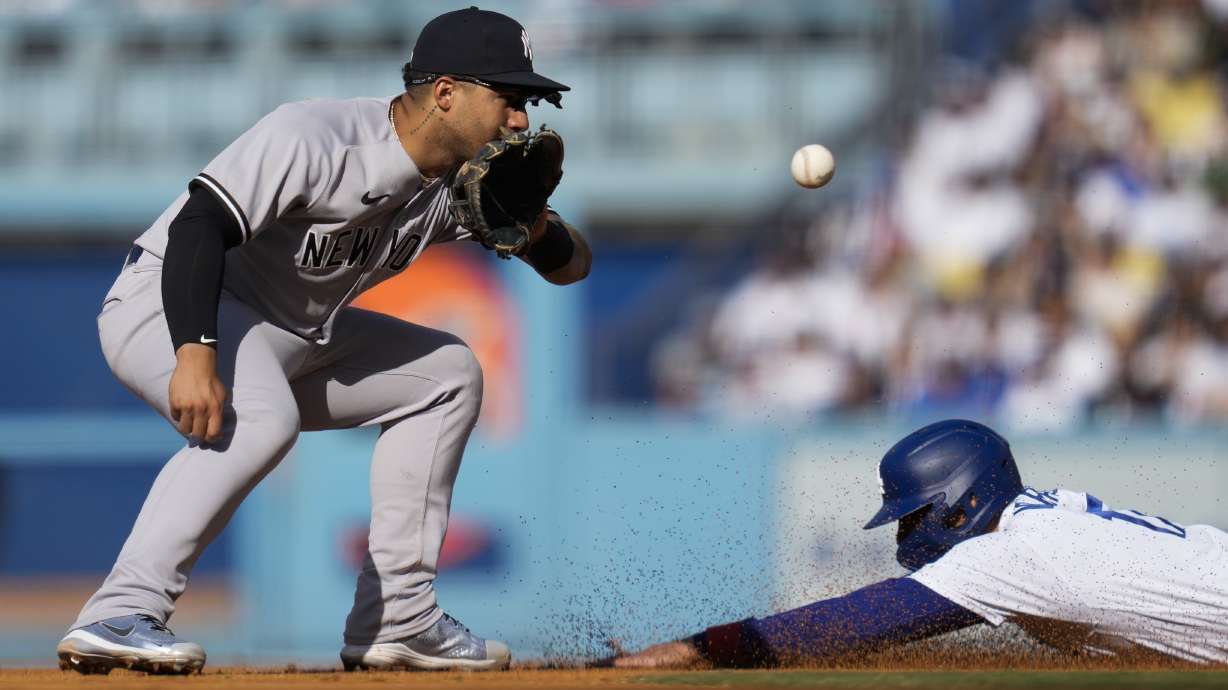 Los Angeles Dodgers' Miguel Vargas, right, is caught stealing second by New York Yankees second baseman Gleyber Torres (25) during the fifth inning of a baseball game in Los Angeles, Sunday, June 4, 2023.
