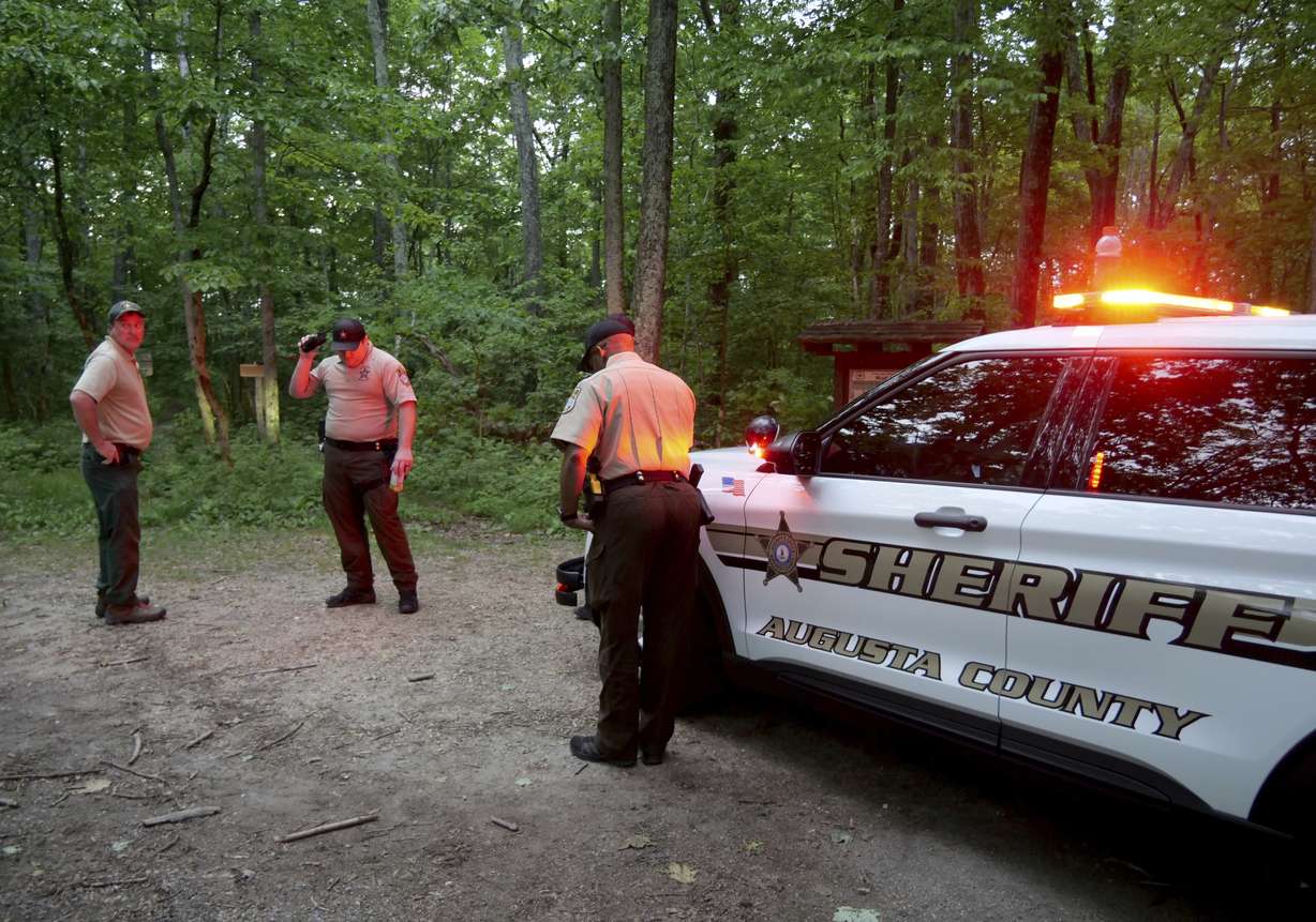 Authorities secure the entrance to Mine Bank Trail, an access point to the rescue operation along the Blue Ridge Parkway where a Cessna Citation crashed over mountainous terrain near Montebello, Va., Sunday.