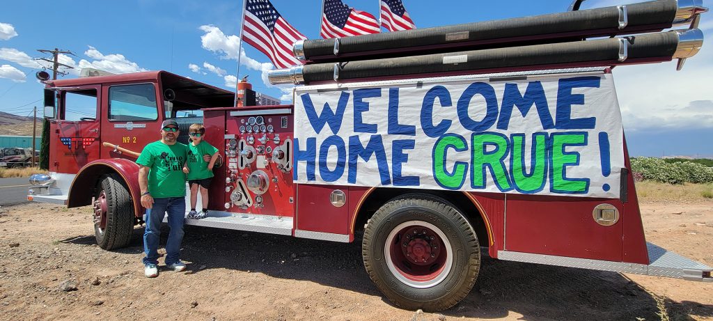 Crue “Tuff” Cash arrives home, after a long hospital stay, to celebrating Southern Utahns and fire trucks in Hurricane on Thursday.
