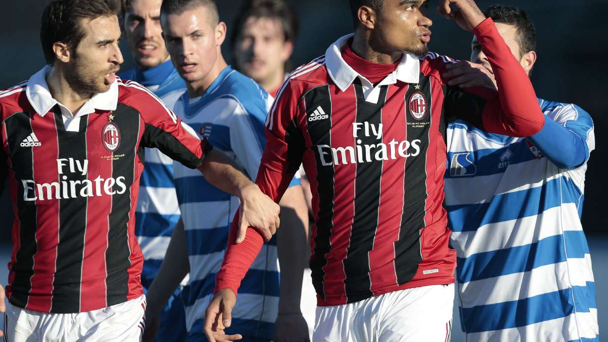 FILE - AC Milan midfielder Kevin-Prince Boateng gestures towards the crowd as he leaves the field after being subjected to racial abuse during a friendly soccer match in Busto Arsizio, near Milan, Italy, Thursday, Jan. 3, 2013. Boateng set soccer on a path toward tougher sanctions in cases of discrimination when he walked off the field to protest racial abuse by an opposing team's fans a decade ago. His teammates had his back when he refused to tolerate the abuse from fans of a small provincial Italian club during a mid-season exhibition game in 2013.