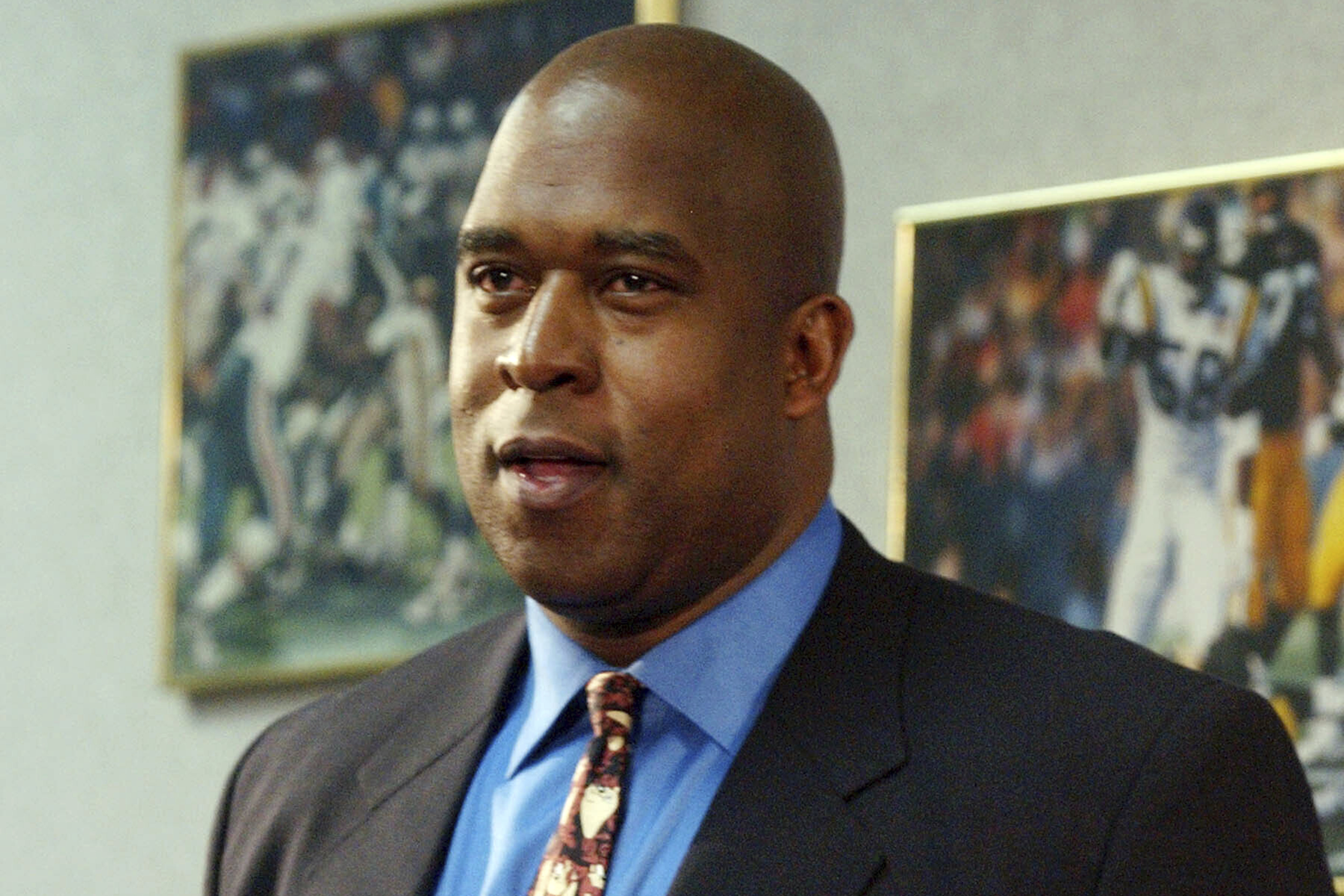 FILE - Arizona businessman Reggie Fowler addresses reporters after Minnesota Vikings owner Red McCombs announced the proposed sale of the team to Fowler, Feb. 14, 2005, in Eden Prairie, Minn. Fowler, a former part owner of the Vikings who defrauded a short-lived professional football league known as the Alliance of American Football while carrying out $700 million cryptocurrency scam was sentenced Monday, June 5, 2023, to over six years in prison.