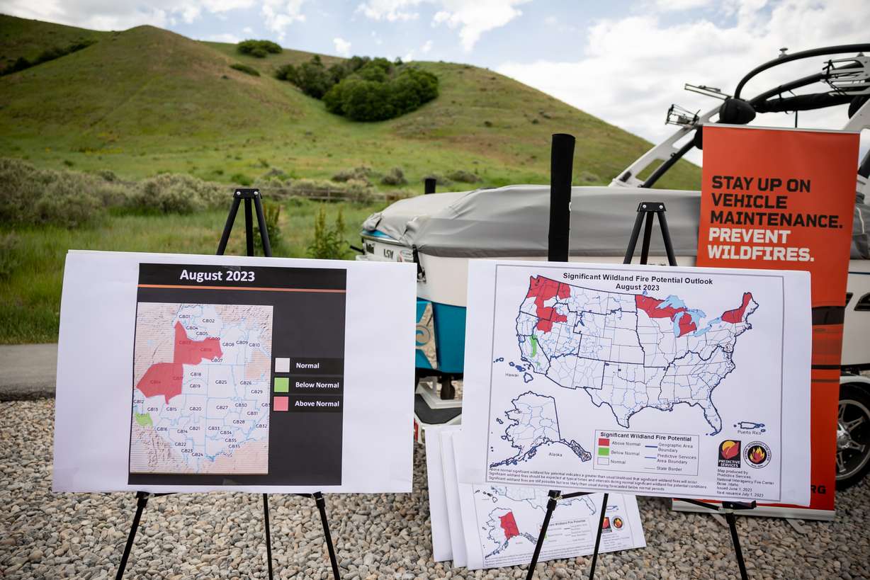 Charts depict wildfire risk during a press conference in North Salt Lake on Monday.