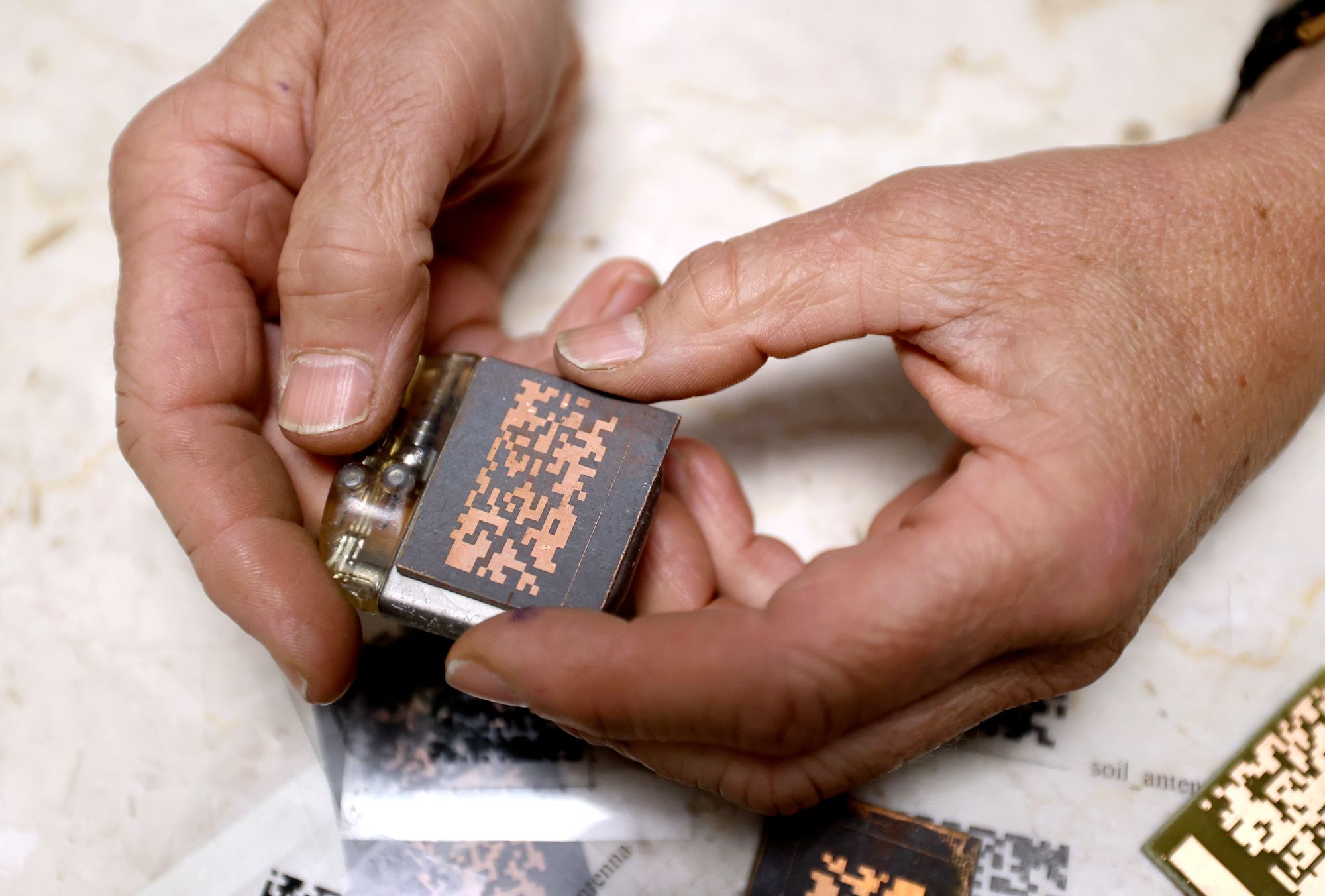 University of Utah Electrical and Computer Engineering Department professor Cynthia Furse holds an antenna over a pacemaker in her office at the University of Utah in Salt Lake City on May 23. Furse says artificial intelligence has been used to develop antennas for decades.