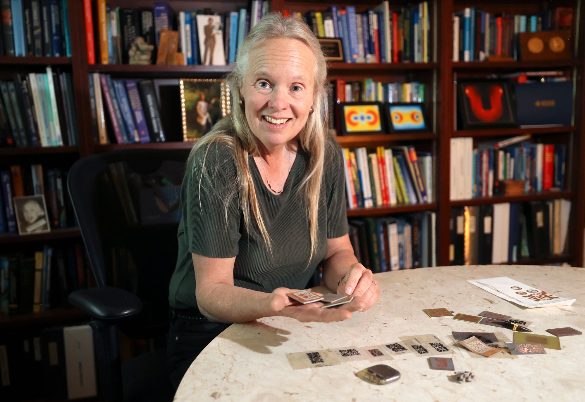 University of Utah Electrical and Computer Engineering Department professor Cynthia Furse holds antennas while posing for a portrait in her office at the University of Utah in Salt Lake City on Tuesday. Furse says artificial intelligence has been used to develop antennas for decades.