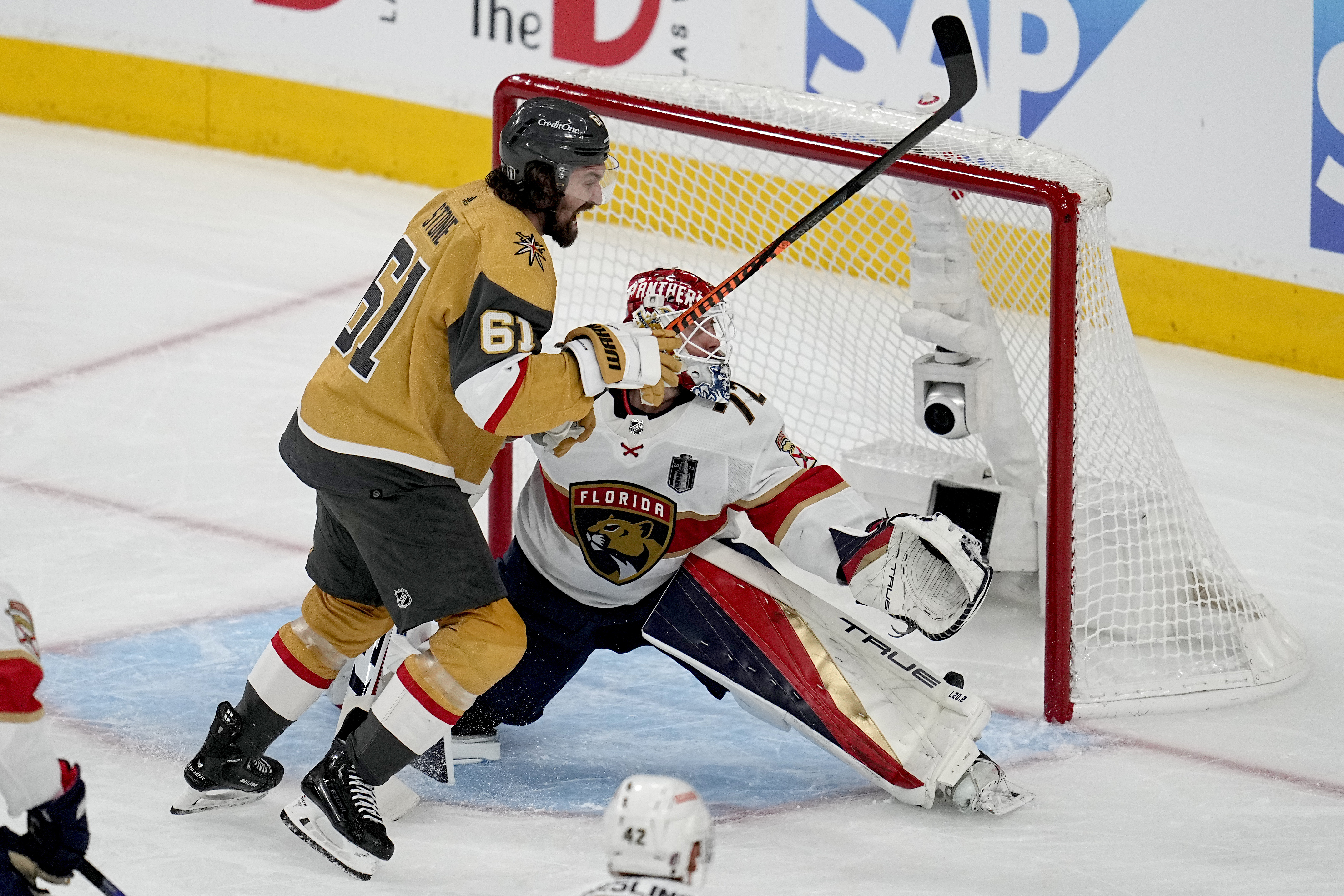 Vegas Golden Knights right wing Mark Stone (61) celebrates a goal by teammate Jonathan Marchessault as Florida Panthers goaltender Sergei Bobrovsky (72) can't make the stop during the first period of Game 2 of the NHL hockey Stanley Cup Finals, Monday, June 5, 2023, in Las Vegas.