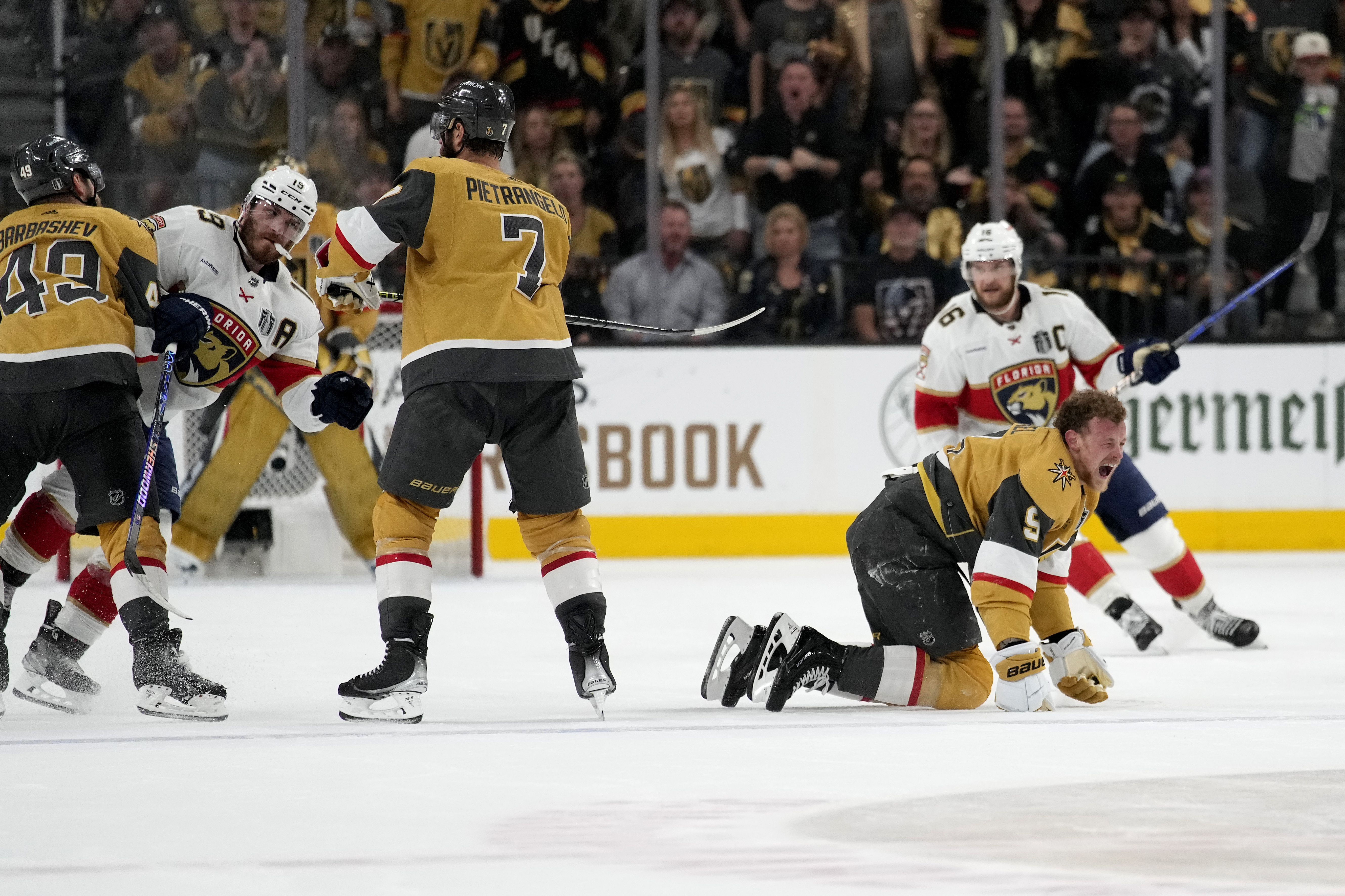 Vegas Golden Knights center Jack Eichel (9) yells after being hit by Florida Panthers left wing Matthew Tkachuk, left, during the second period of Game 2 of the NHL hockey Stanley Cup Finals, Monday, June 5, 2023, in Las Vegas.
